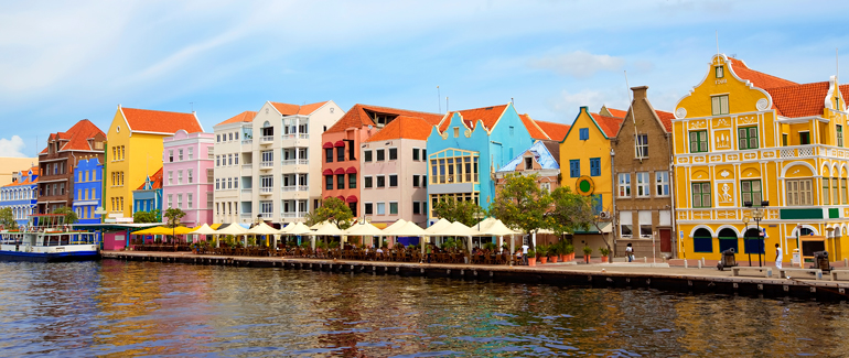 Head south to the Caribbean for some sun and sand. This former Dutch colony is known for the colorful architecture along its harbor. 